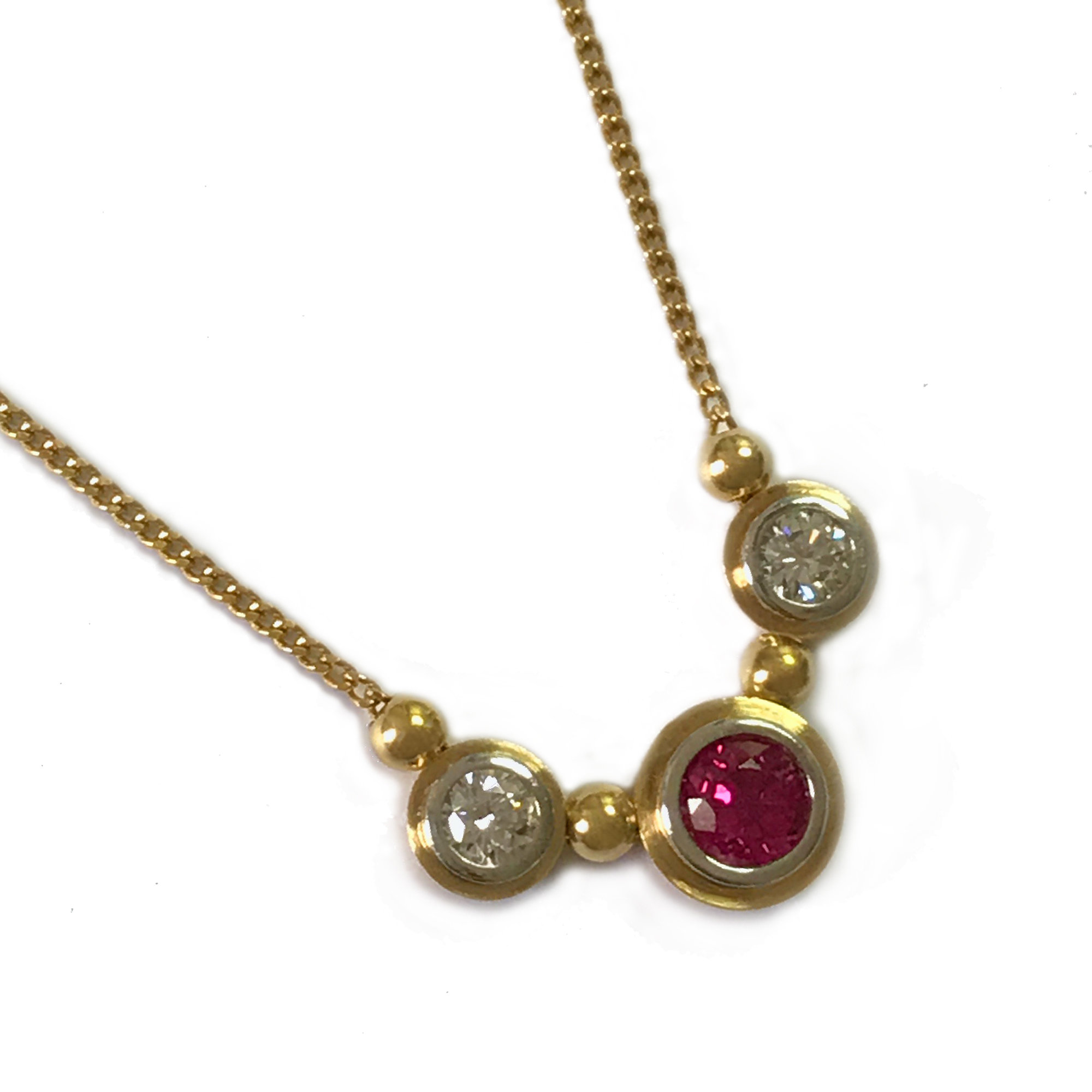 gold necklace with stone pendant